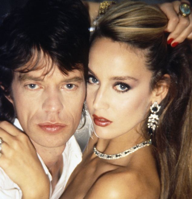 01 Jan 1981, UK --- Singer Mick Jagger of the Rolling Stones hugs his longtime love, fashion model Jerry Hall. The couple was married from 1990 until 1999. --- Image by © Norman Parkinson/Sygma/Corbis